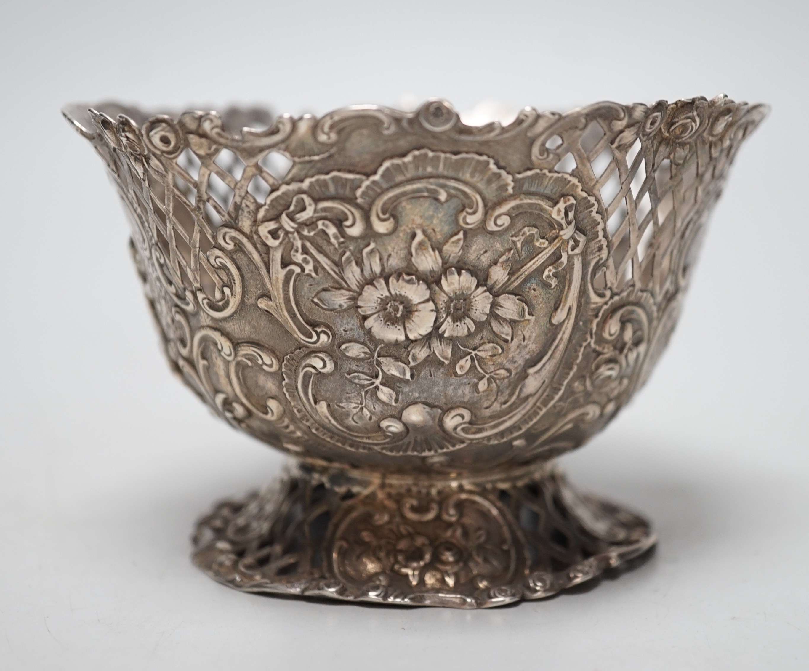 A late 19th century French pierced embossed silver bowl, on circular foot, import marks for William Moreing, London, 1894, diameter 12.2cm, 5.8oz.